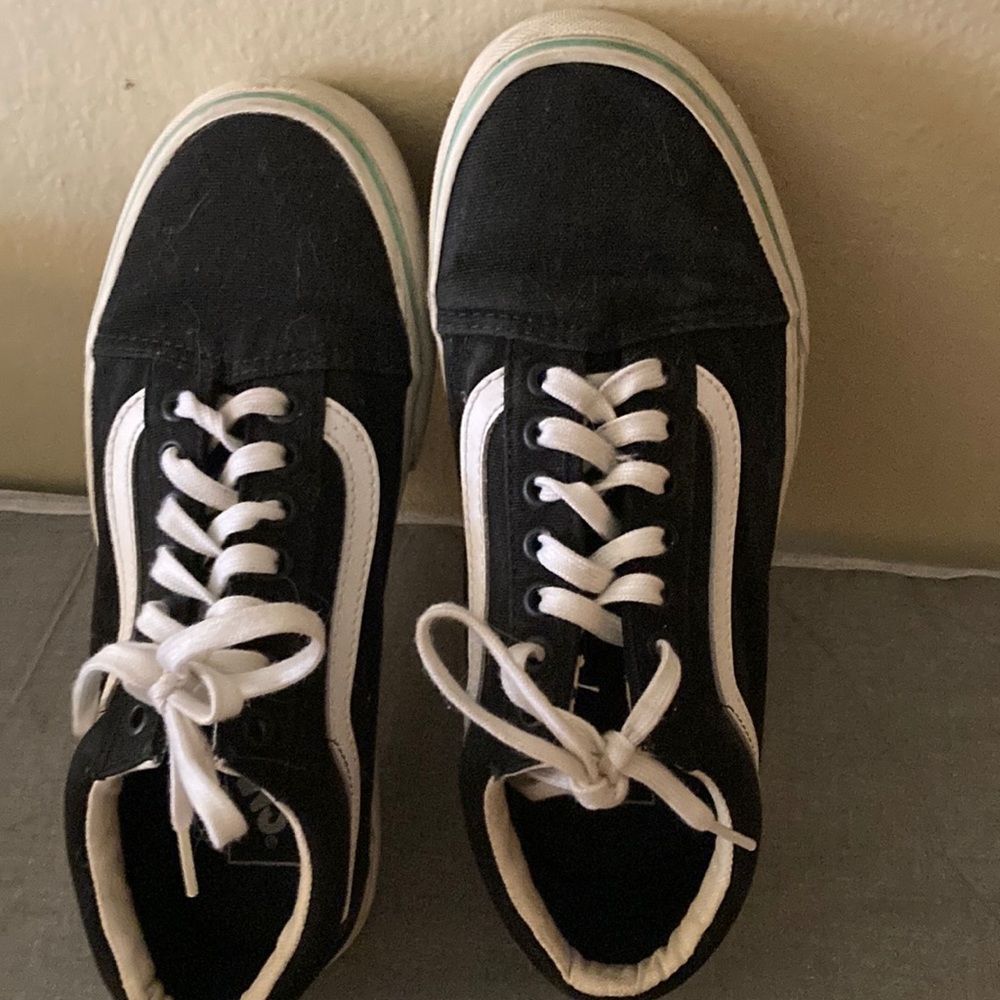 Black vans with lime green lining